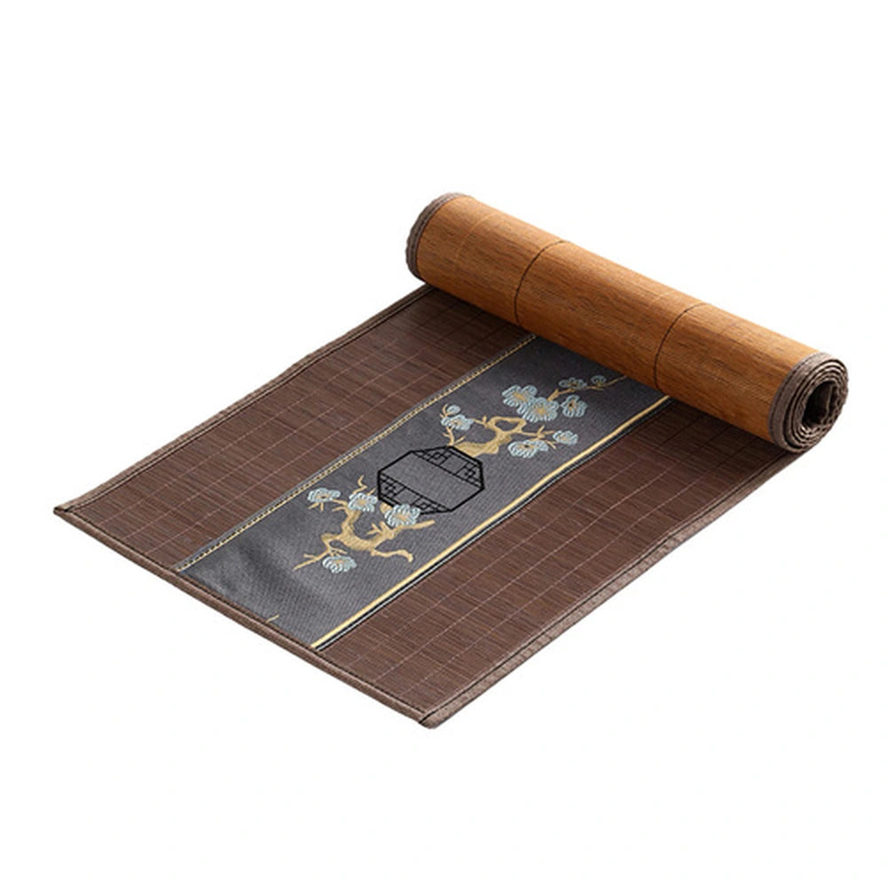Chemin de table en bambou marron roulé, bandeau brodé gris ardoise à pin doré