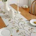 Chemin de table en coton-lin brodé de fleurs jaunes avec bougies