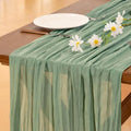 Chemin de table en gaze vert sauge avec marguerites