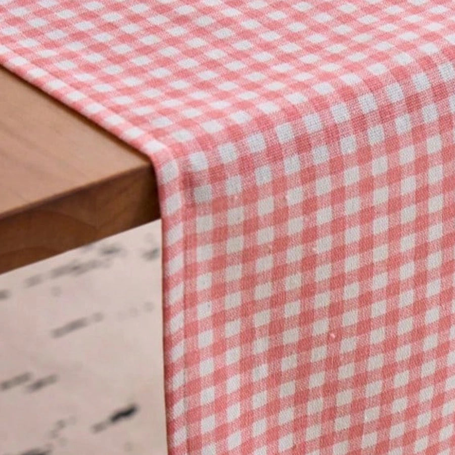 Gros plan du tissage à carreaux vichy rose et blanc